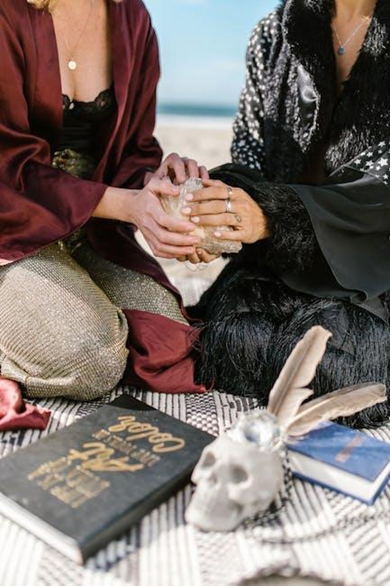 Previsioni_zodiacali_di_fine_settimana_la_fortuna_del_2223_febbraio_5_classificato_lAriete_sfTvMW8txQ - Confidenze24 Source: RDNE Stock project - pexels - Two people engage in a magical ritual outdoors with books and a crystal ball, invoking mystical themes.
