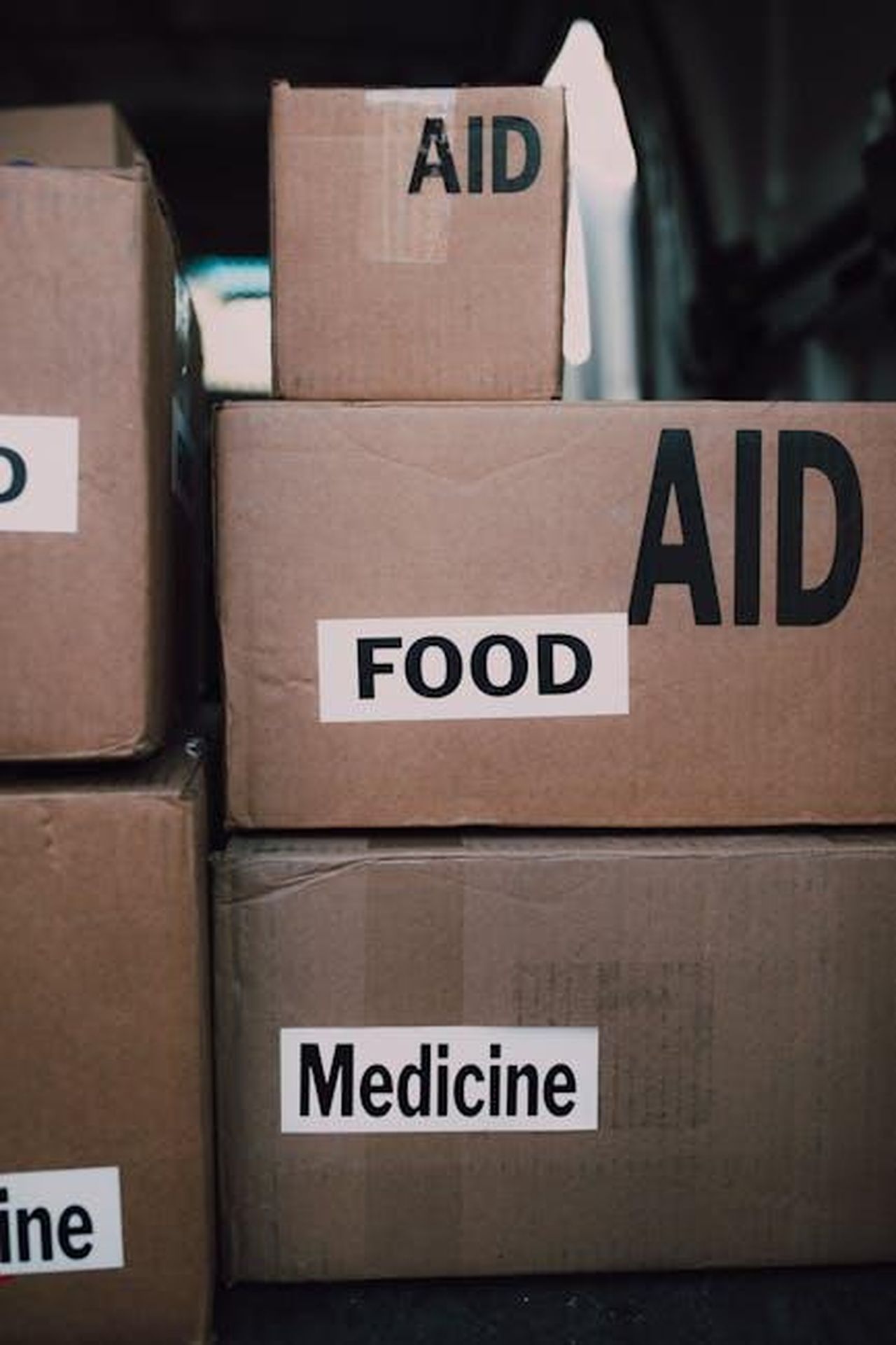 Source: RDNE Stock project - pexels - Close-up of aid packages with labels for food and medicine, symbolizing charity and support.