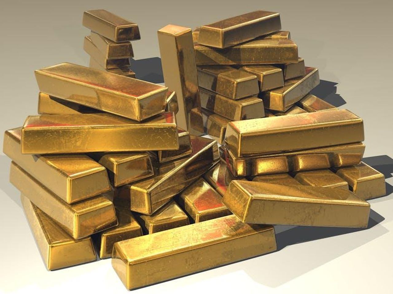 La_ricchezza_di_Jennifer_Tilly_YfEwCgQGaz - Confidenze24 Source: Pixabay - pexels - A pile of lustrous gold bars symbolizing wealth and prosperity.
