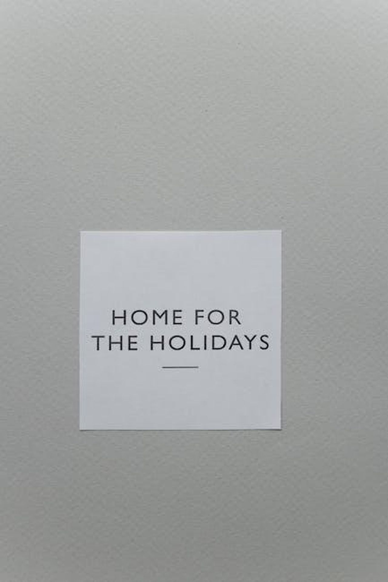 Quando_esce_la_Stagione_4_di_The_Way_Home_LEDbHNpQRb - Confidenze24 Source: Monstera Production - pexels - A simple 'Home for the Holidays' greeting card on a textured gray surface, perfect for festive messages.